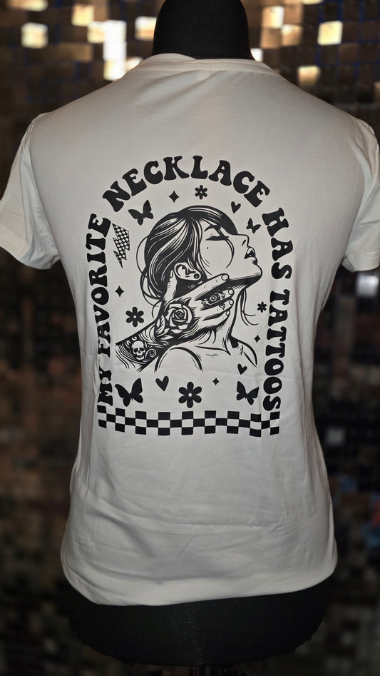 White t-shirt with black graphic design and text on a blurred background