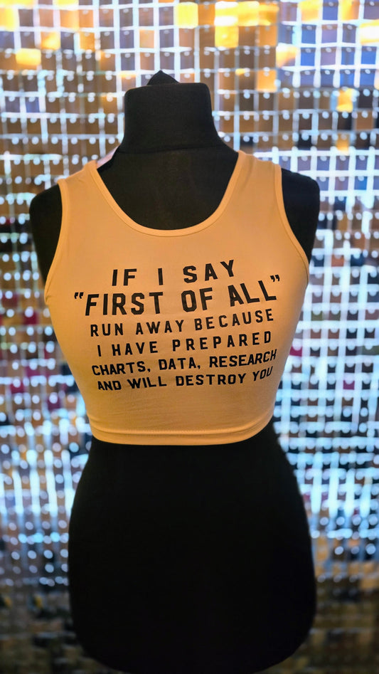 Yellow tank top with text on a mannequin against a patterned background